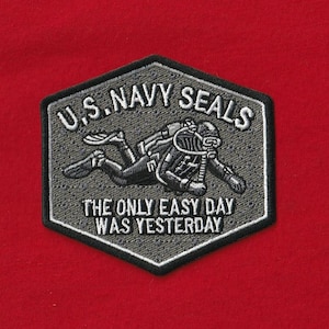 May include: A rustic wooden sign with the text "Welcome to our home" in white lettering. The sign features a distressed finish and a simple, inviting design, perfect for front door decor.