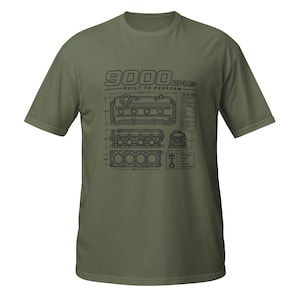 May include: An olive green short-sleeve t-shirt featuring a black graphic print of an engine blueprint. The design includes the text 9000 RPM BUILT TO PERFORM, technical diagrams of engine components, and various measurements in millimeters.