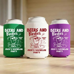 May include: Three beverage can coolers in green, white, and purple. Each cooler has the text "BEERS AND Birdies" and "JACK'S BACHELOR PARTY" with a golf-themed graphic. The date "AUGUST 2026" is also printed on each cooler.