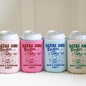 May include: Four beverage can coolers in pastel colors: pink, hot pink, light blue, and beige. Each cooler has a white can top and features the text "BEERS AND Birdies" with a golf-themed graphic and "JACK'S BACHELOR PARTY" text.