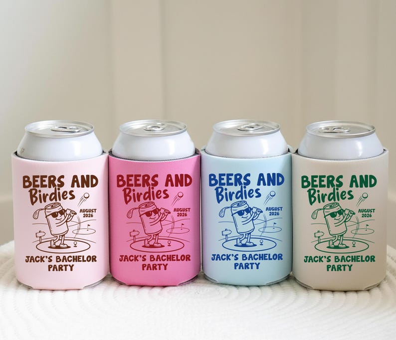 May include: Four beverage can coolers in pastel colors: pink, hot pink, light blue, and beige. Each cooler has a white can top and features the text "BEERS AND Birdies" with a golf-themed graphic and "JACK'S BACHELOR PARTY" text.