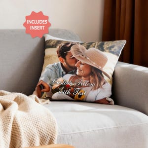 May include: A custom pillow with a printed photo of a couple, the text "Custom Pillow with Text" is visible. The pillow is on a gray couch with a beige blanket. A red starburst graphic says "INCLUDES INSERT".