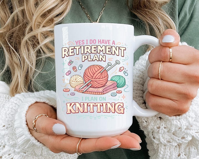 May include: White ceramic mug with the text "YES I DO HAVE A RETIREMENT PLAN I PLAN ON KNITTING". The mug features illustrations of yarn balls, knitting needles, and buttons in pastel colors. A perfect gift for knitters.