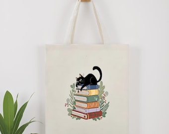 Bolsa de lona con diseño de gato sobre libros, ideal para amantes de los libros, regalo para profesores, uso diario.