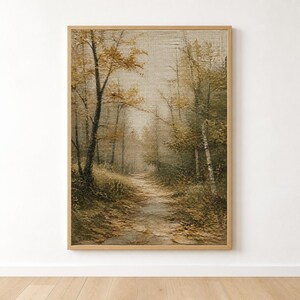 May include: A framed vertical wall art print featuring an oil painting of a forest path during autumn. The scene depicts trees with golden and brown foliage lining a dirt trail that leads into the distance, all rendered with visible brushstrokes.