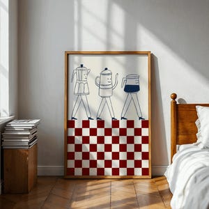 May include: A framed art print featuring three whimsical coffee pots with legs, walking across a red and white checkered pattern. The artwork is in a wooden frame and hangs on a white wall, adding a touch of playful decor.