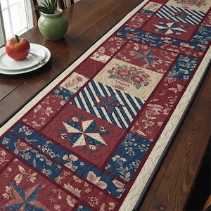 May include: A rectangular table runner with a patchwork design. The runner features alternating blocks of red, blue, and beige fabric. The red blocks have floral and star patterns, while the blue blocks have stripes. The runner is on a wooden table.