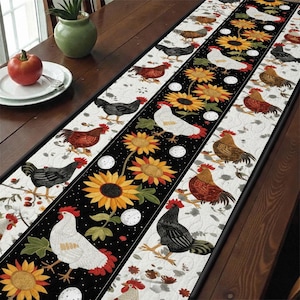 May include: A decorative table runner featuring a repeating pattern of chickens, sunflowers, and eggs. The runner has a black center stripe with sunflowers and white eggs, bordered by white sections with chickens.