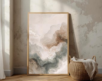 May include: Abstract art print in a wooden frame. The artwork features a blend of neutral colors, including beige, brown, and gray, creating a layered, flowing design. The print is displayed against a neutral-toned wall, with a woven basket in the foreground.