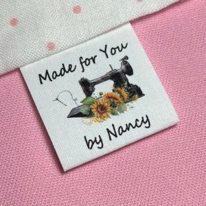 Custom Sewing Labels Precut frayless fabric sew in loop fold, 2 sided labels with multi choice of featherweight sewing machine graphic.