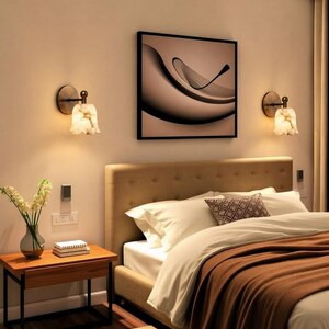 Modern brass wall sconce set with alabaster stone shade, minimalist bedroom wall lighting on grey background Mid century brass wall lights with white alabaster tulip shades, luxury wall sconce pair for bedroom decor Set of two brass wall sconces with natural alabaster shades, elegant modern wall lighting fixture Minimal brass wall lamps with alabaster shade, bedside wall lighting pair on neutral grey wall Luxury brass wall sconce pair with alabaster tulip glass shade, modern wall lighting.