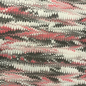 May include: A sheet of paper featuring a marbled pattern with repeating wave-like shapes in black, white, and muted red. The design consists of vertical columns of interlocking, curved lines that create a dense, textured visual effect across the surface.