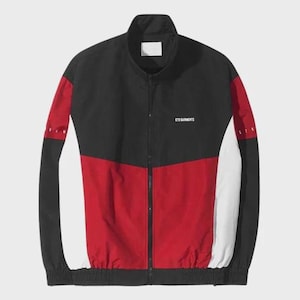 May include: A black, red, and white track jacket with a full zip. The jacket has a colour-block design, with black on the top and sleeves, red in the centre, and white on the sides. The text "ETD GARMENTS" is printed on the chest.