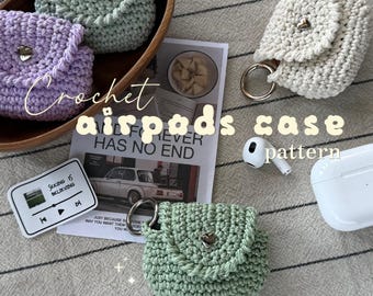 May include: Three crochet Airpods cases in light green, lavender, and cream, each featuring a flap with a heart-shaped metal button and a silver ring. Text on the image reads: Fits Airpods 3 & 4, Crochet airpods case pattern, and yarnmadem.