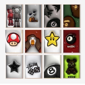 May include: A collection of twelve framed art pieces featuring pop culture icons and symbols. The artwork includes figures, stars, and a mushroom, rendered in vibrant colors and glossy finishes. The pieces are arranged in a grid.
