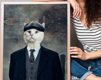 May include: A framed portrait featuring a white cat dressed in a black suit, vest, tie, and a flat cap. The cat portrait is held by a person wearing a striped shirt and jeans. The background is a blurred, urban scene.