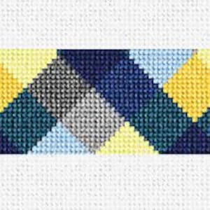 May include: A geometric pattern with yellow, blue, and gray triangles. The pattern is repeated horizontally.