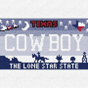 May include: A cross-stitch design of a Texas license plate. The plate features the word "COWBOY" in white, with "TEXAS" in red above. The bottom reads "THE LONE STAR STATE" in white. The design includes a cowboy on a horse, a Texas flag, and other Texas-themed imagery.