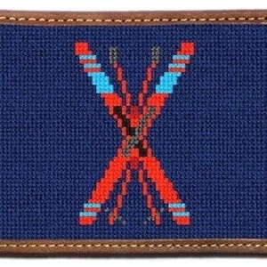 May include: A blue and red needlepoint wallet with a geometric design. The wallet has a brown leather border.