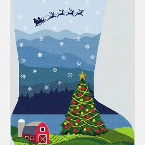 May include: Christmas stocking with a festive design. The top features the name "WADE" and green trees. Below, a snowy landscape with a Christmas tree, a red barn, and Santa's sleigh. The tree is decorated with red and yellow ornaments.