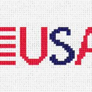 May include: A cross-stitch design featuring the word "USA" in red and blue thread, surrounded by small American flags with red, white and blue stars.
