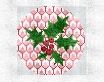 May include: A pink and white geometric pattern with a green holly sprig and red berries in the center.