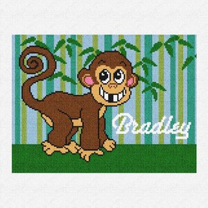 May include: A brown monkey with a big smile and large eyes is sitting in a green jungle setting. The monkey's name is Bradley, which is written in white letters on a blue and green striped background.