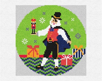 May include: A green and white Christmas ornament featuring a cartoon Santa Claus holding a toy soldier. The ornament is surrounded by presents and snowflakes.