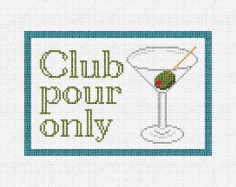 May include: Cross-stitch design featuring a martini glass with an olive and the words "Club POUR only" in green. The design is framed in a teal border on a white background, suitable for home decor.
