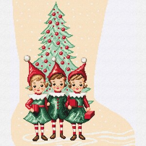 May include: Christmas stocking with a festive design. Features three elf figures in green outfits and red hats, standing in front of a Christmas tree. The stocking has the name "Marianne" in red at the top.