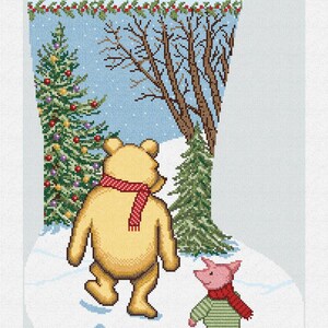 May include: A needlepoint Christmas stocking featuring Winnie the Pooh and Piglet walking in the snow. The stocking has a blue background with a Christmas tree and bare trees. The name "Georgianna" is stitched at the top.