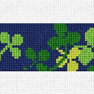 May include: A blue and green cross stitch pattern featuring a repeating design of four-leaf clovers.