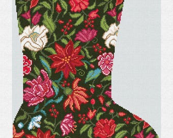 May include: A Christmas stocking with a dark green background, covered in a floral pattern of red, pink, and white flowers, with green leaves and berries. The word "Madeline" is embroidered in green at the top.