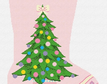 May include: Pink Christmas stocking with a green Christmas tree decorated with colorful ornaments. The stocking has the name "Katie" in green script at the top and a bow at the top of the tree.