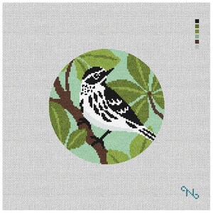 May include: A needlepoint canvas featuring a circular design of a black and white warbler perched on a brown tree branch against a light green background with green leaves. A color palette key is visible in the top right corner of the canvas.