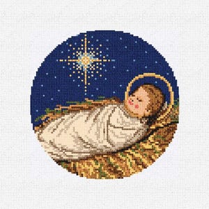 May include: A round cross-stitch design depicting a baby in a manger, wrapped in white cloth. A golden halo surrounds the baby's head. A bright star shines above against a dark blue background, with smaller stars scattered around.