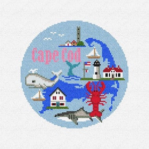 May include: A blue and white embroidered design of Cape Cod, Massachusetts, featuring a whale, a lighthouse, a lobster, a house, and a sailboat. The text "Cape Cod" is embroidered in pink.