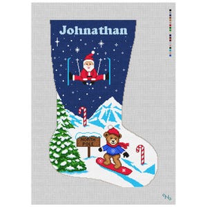 May include: A needlepoint canvas of a Christmas stocking featuring the name Johnathan in light blue text. The design shows Santa skiing on a dark blue starry background above a snowy landscape with a green pine tree, candy canes, and a brown bear on a red snowboard near a North Pole sign.