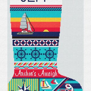 May include: A nautical-themed Christmas stocking with the name "JEFF" in white block letters. The design includes sailboats, a sunset, ship wheels, and a compass. The phrase "Anchor's Aweigh" is also featured.