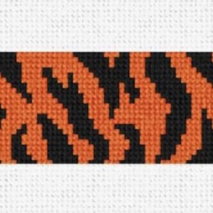 May include: A rectangular strip featuring a bold tiger stripe pattern. The design showcases alternating bands of black and orange, creating a striking contrast. The background is a plain white canvas, highlighting the vibrant pattern.