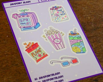 May include: A sticker sheet featuring various cinema-themed illustrations. Designs include a retro TV, popcorn, a bag of sweets, a can of juice, a bag of crisps, and 3D glasses. The text "SAVEPOINT BLOOM" and social media details are also present.
