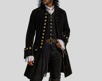 May include: A black pirate coat with gold buttons, paired with a matching vest and pants. The coat features ornate cuffs and a long, flowing design. A brown leather belt and a tricorn hat complete the ensemble. The outfit is reminiscent of historical pirate attire.