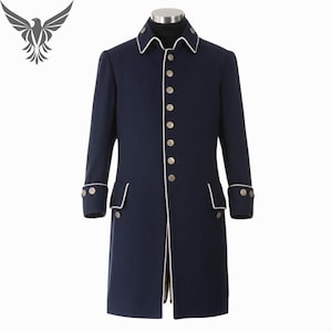 May include: A navy blue coat with white trim and gold buttons. The long coat features a classic design with a notched collar, front pockets, and buttoned cuffs. The coat is displayed on a mannequin.