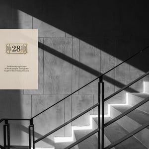 May include: A black and white photograph of a wall with a wooden sign and a staircase. The sign has a ticket design with the number 28 and text below. The text reads, "Took twenty-eight years of blood pumping through me to get to this evening with you."