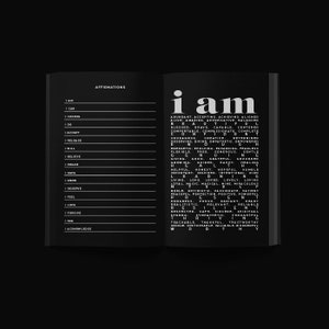 May include: Open book with black pages. The left page lists affirmations like "I am" and "I can." The right page features the words "I am" in large white letters, followed by a list of positive attributes in a vertical format.