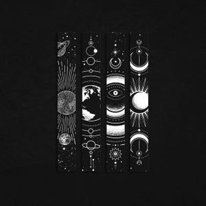May include: Four black bookmarks with white celestial designs. Each bookmark features a different cosmic theme, including planets, the sun, the moon, and stars. The designs are detailed and artistic, creating a mystical and celestial aesthetic.