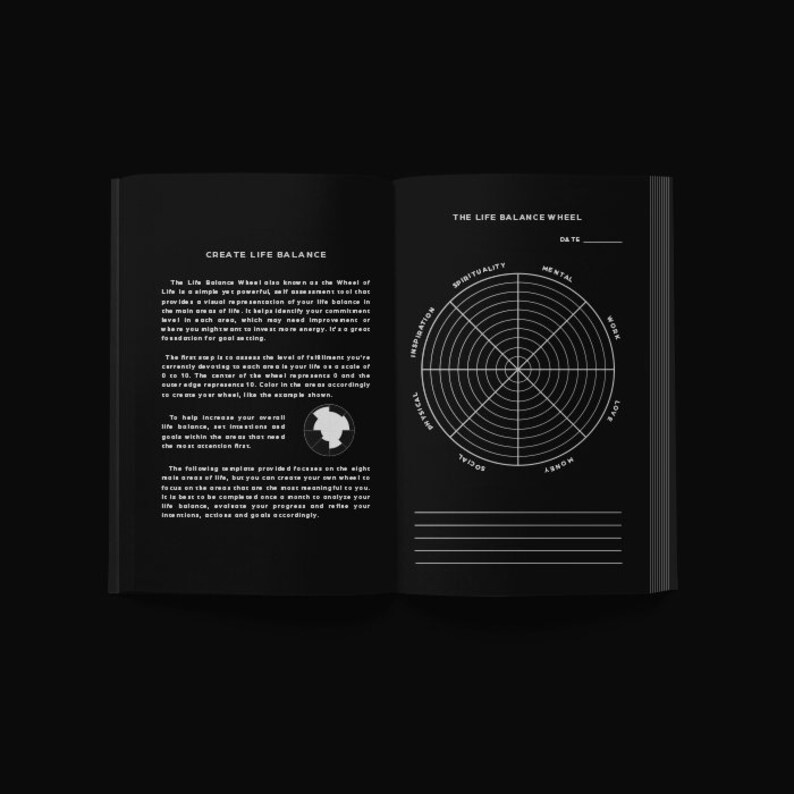 May include: Open notebook with a black cover, featuring a 'Create Life Balance' section and a 'Life Balance Wheel' diagram. The wheel is divided into segments like 'Spirituality' and 'Mental'. The pages are white with black text.