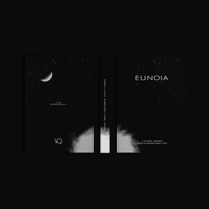 May include: A black journal with the word "EUNOIA" in white on the cover, along with a starry sky design. The journal's spine reads "EUNOIA INTERNATIONAL LIVING JOURNAL". The front cover features a crescent moon and the words "LIVE INTENTIONALLY".