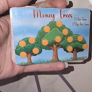 May include: A card featuring three green trees with orange coin-like fruit against a blue sky. The text "Money Trees" is displayed, with "£1 Per Tree" and "50p Per Coin" also visible.