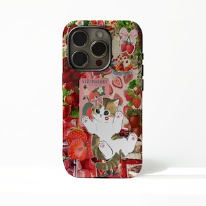 May include: A phone case featuring a collage of strawberries and a playful kitten illustration. The case has a red and white color scheme with the word "STRAWBERRY" printed on it. The kitten has a bow and red lipstick.